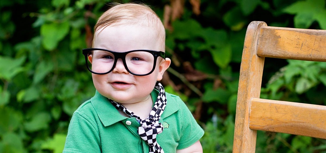 Boy with Black Glasses and Green Shirt