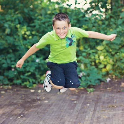 Boy jumping and smiling